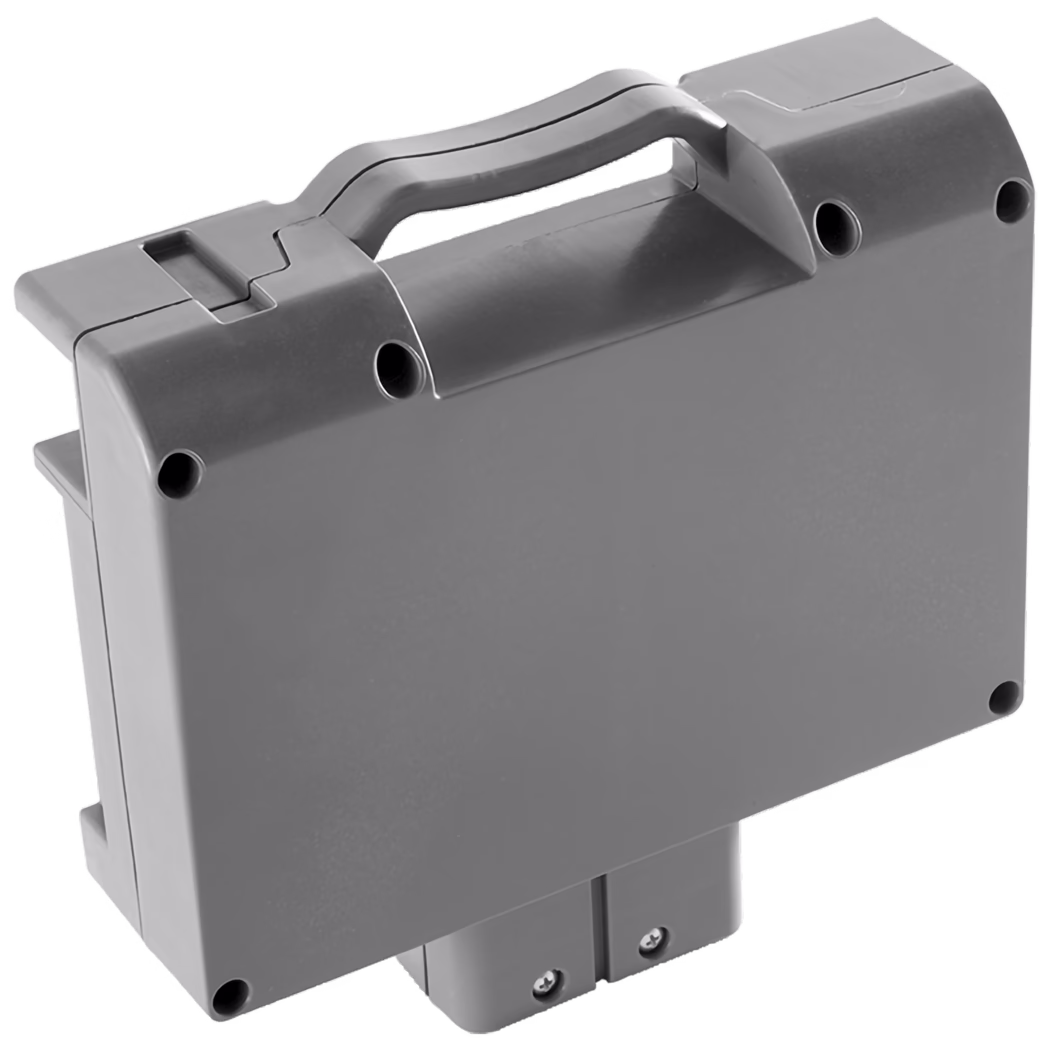 WOLFF_Dummy_83150_Replacement Battery_2025-08 A sturdy gray portable case designed for storage and transport. It features a molded handle for easy carrying, a flat top surface, and visible screws on the bottom for assembly. The case has slight wear, indicating it is used but still functional. There are circular holes on the sides that could serve various purposes, such as ventilation or securing the case.
